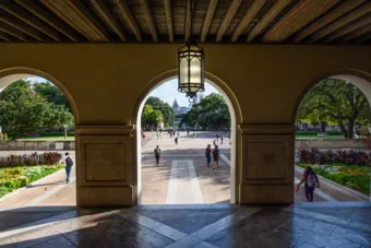 arches of main building looking towards capitol building with students