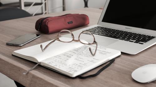 glasses, book and laptop